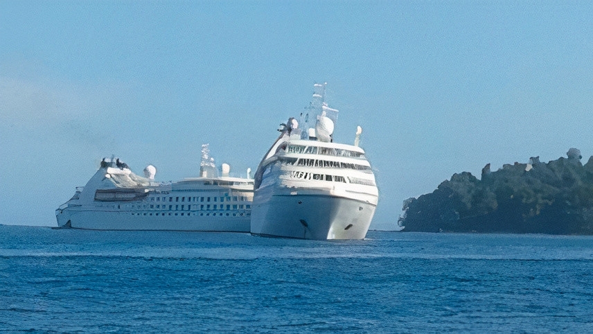 A cruise liner at sea, tilted to her port side
